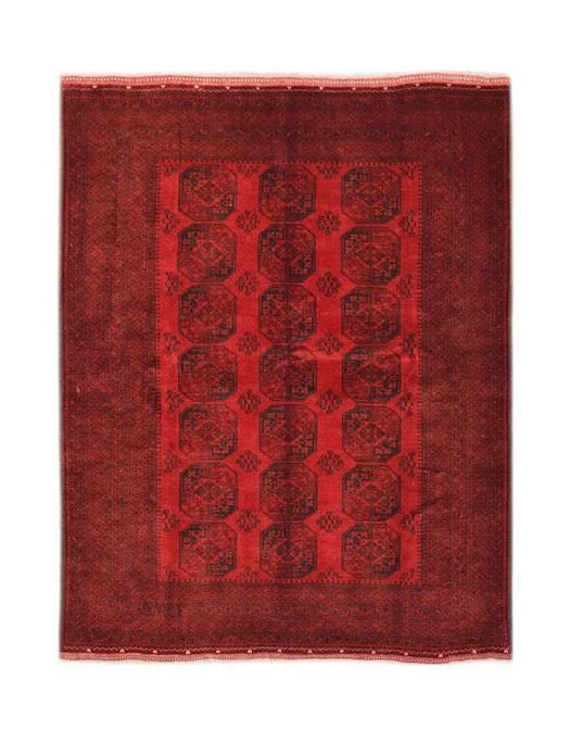 A vintage Afghan Turkmen rug featuring a repeating octagonal gul pattern in deep red and black.