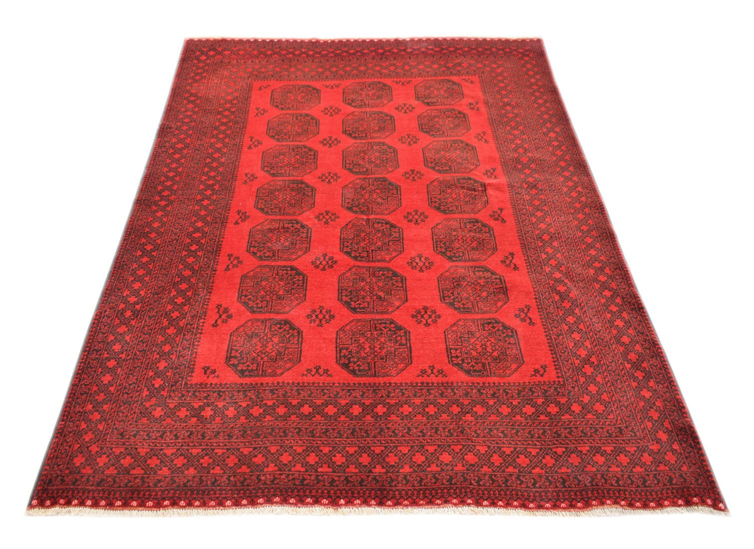 A vintage handmade Afghan Turkmen rug featuring a red field with repeating black elephant foot motifs.