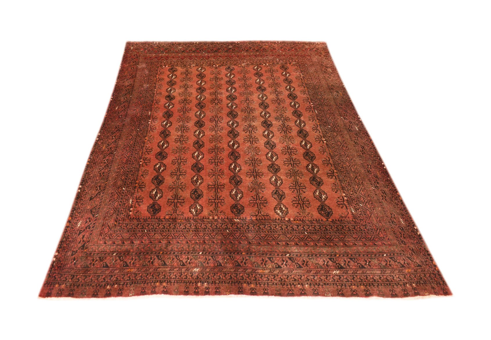 A vintage handmade Afghan Turkmen rug featuring a repeating geometric elephant foot motif.