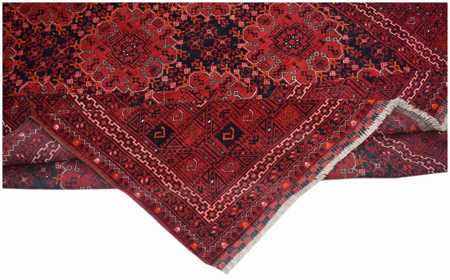 A vintage Afghan Turkmen rug featuring a traditional red and black geometric elephant foot motif.
