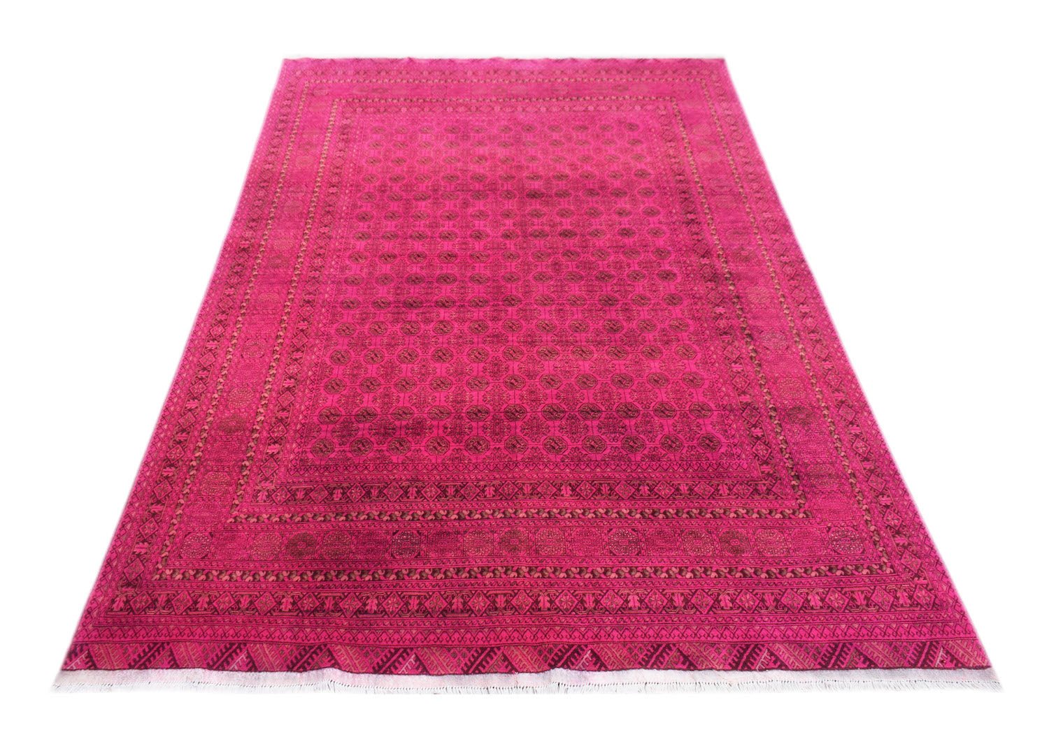 A vintage handmade Afghan Turkmen rug featuring a repeating geometric elephant foot motif in pink.