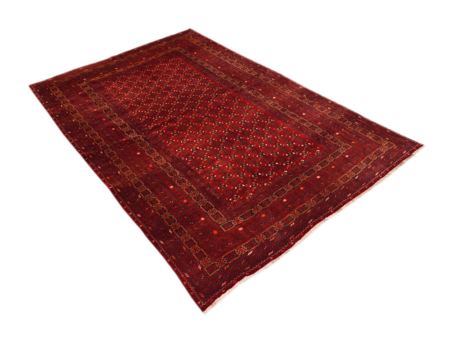 A vintage handmade Afghan Turkmen rug featuring a deep red field with repeating geometric motifs.