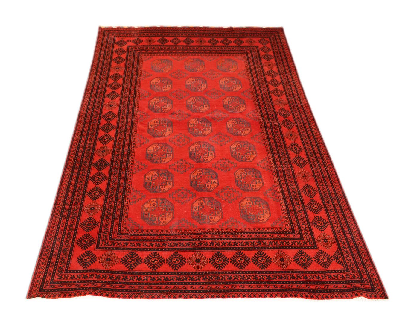 A vintage Afghan Turkmen rug featuring a repeating red and black elephant foot motif.
