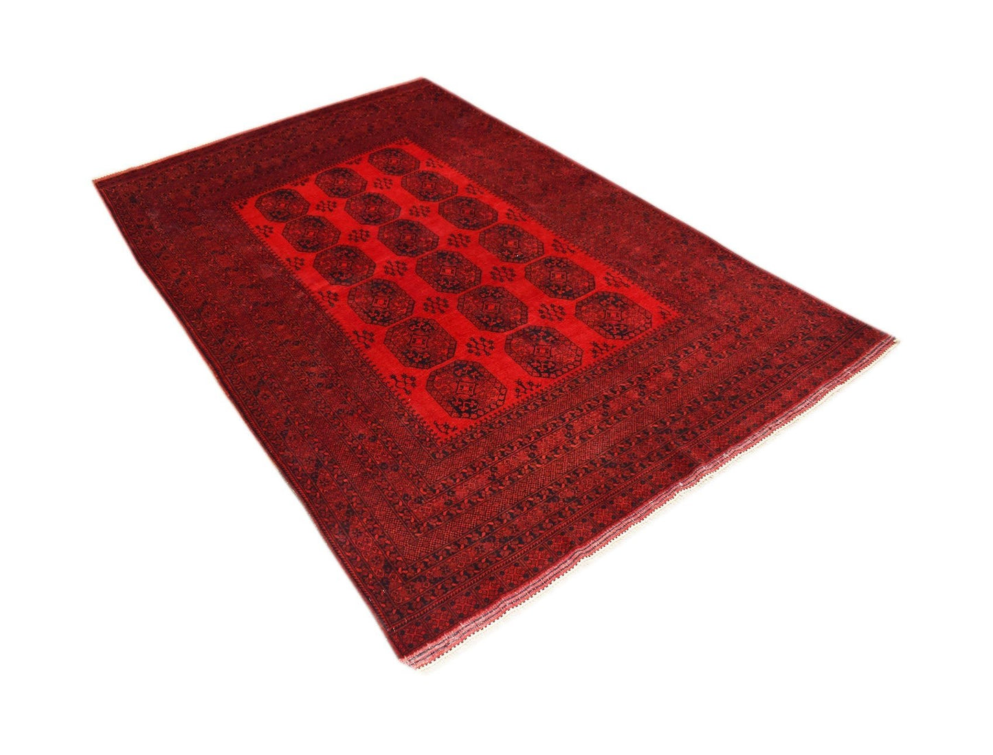 A vintage handmade Afghan Turkmen rug featuring a repeating red and black elephant foot motif.
