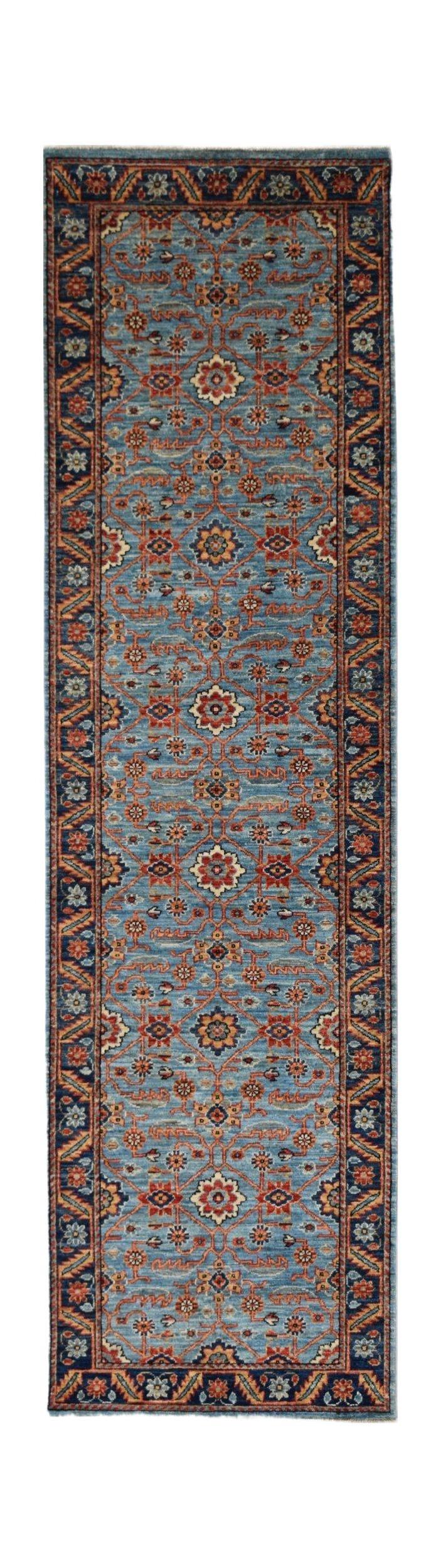 Handmade Afghan Chobi runner rug featuring a traditional floral pattern in blue and rust tones.