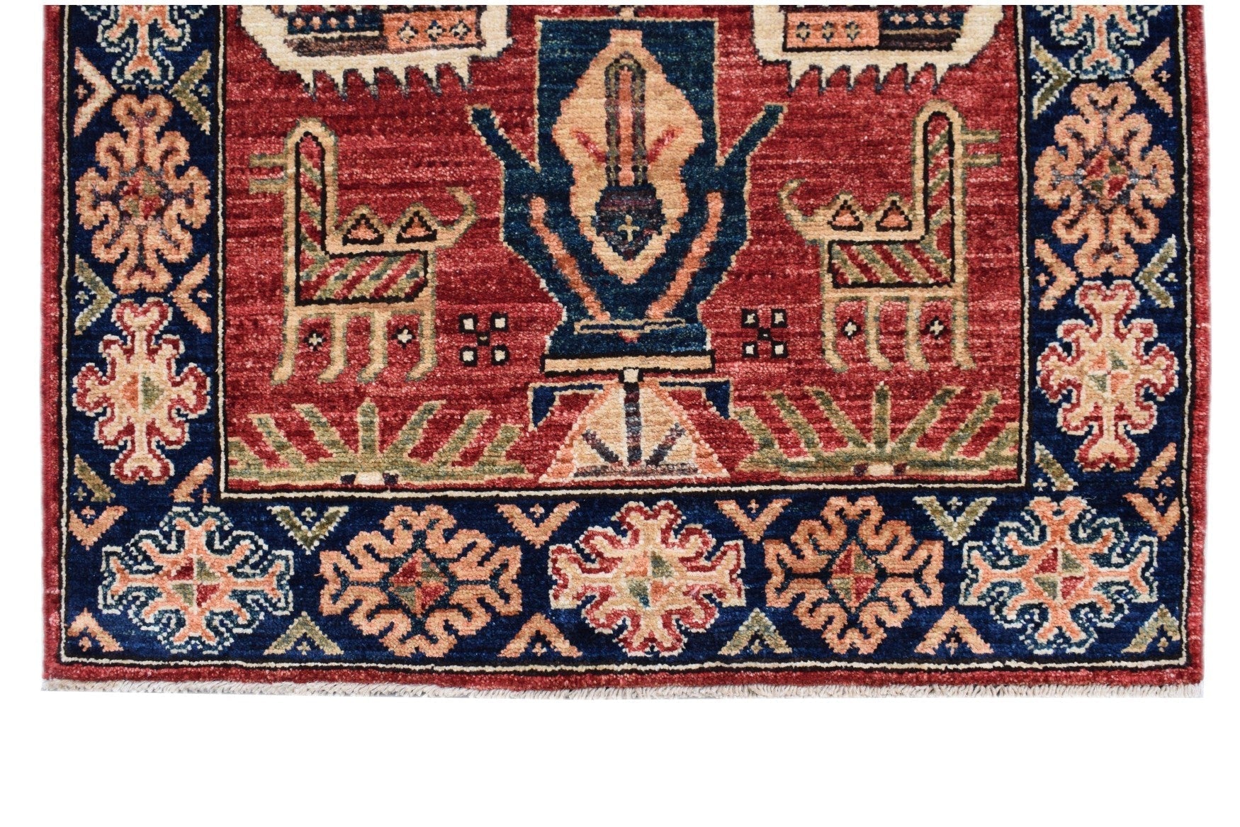 Handmade Afghan Chobi runner featuring a red field with stylized animal and floral motifs.