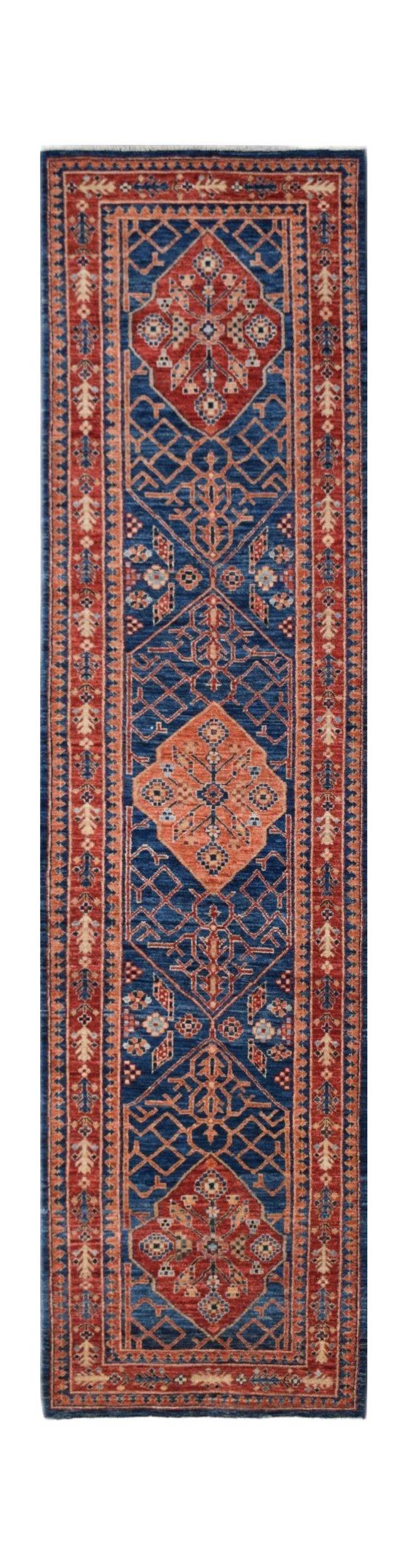A handmade Afghan Chobi runner rug featuring geometric patterns in blue, red, and orange tones.