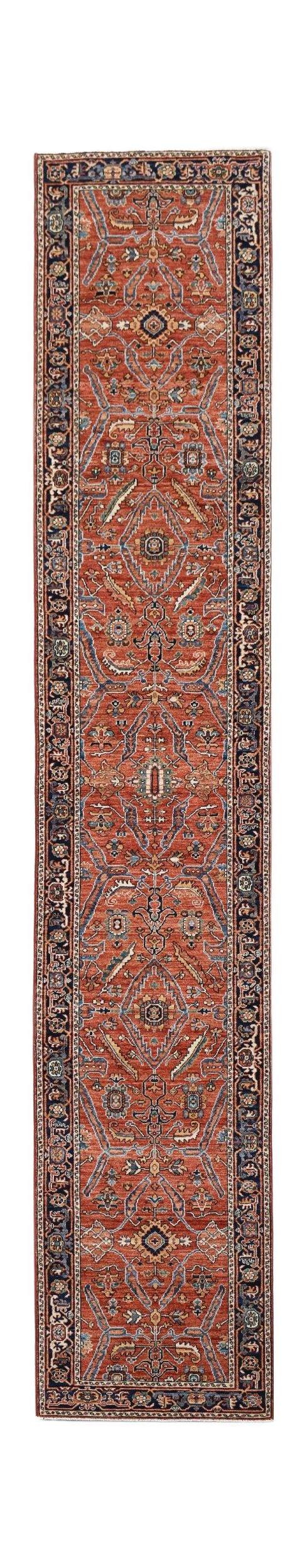A long, handmade Afghan Chobi runner rug featuring a traditional floral pattern in rust and blue.