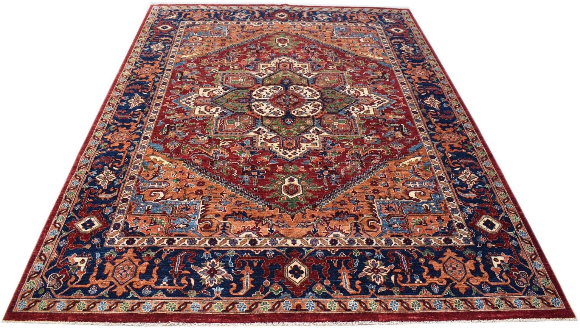 A handmade Afghan Chobi rug featuring a traditional Heriz pattern in red, blue, and earthy tones.