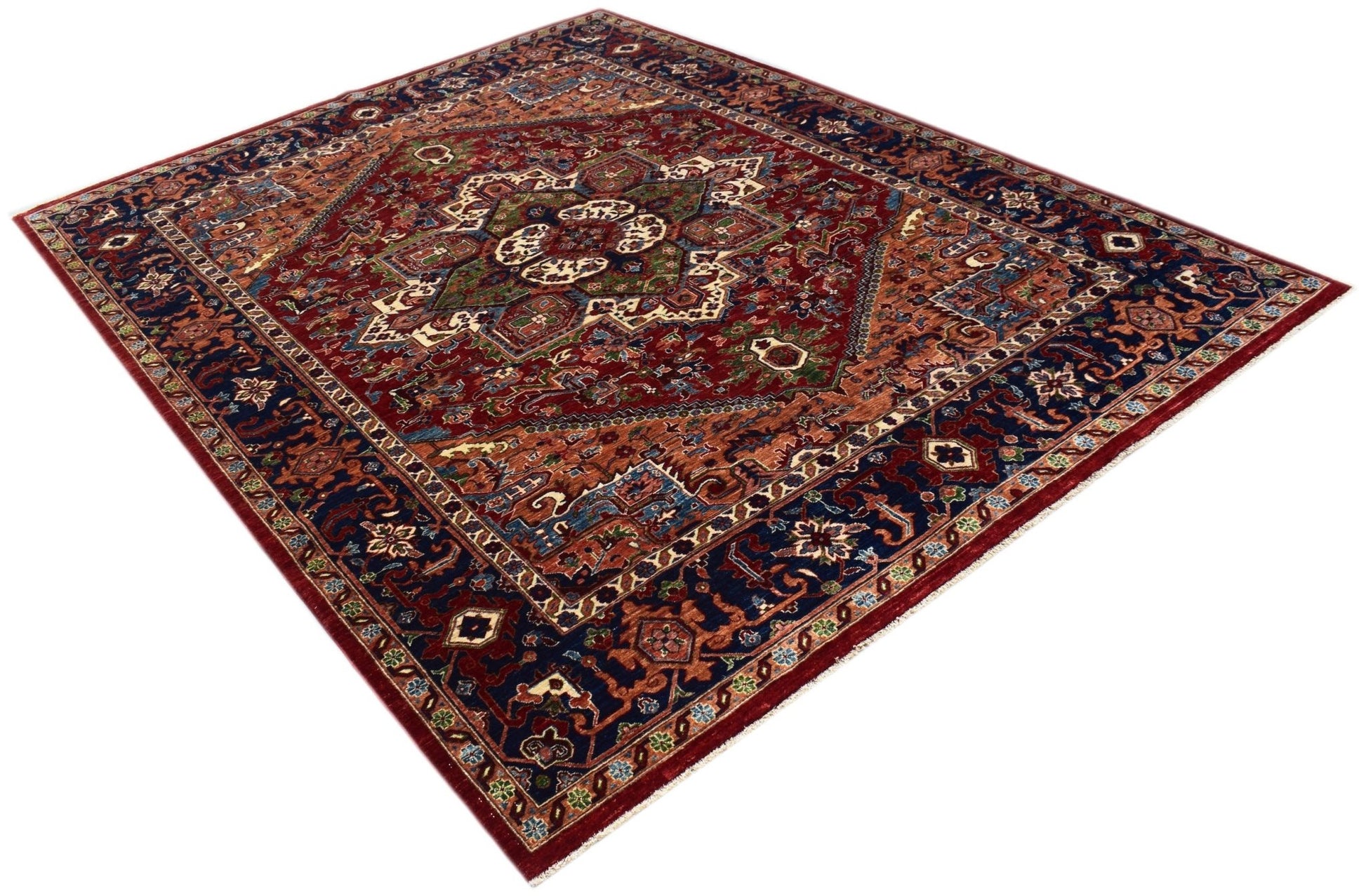 A rectangular Afghan Chobi rug featuring a traditional Heriz pattern in red, blue, and green tones.