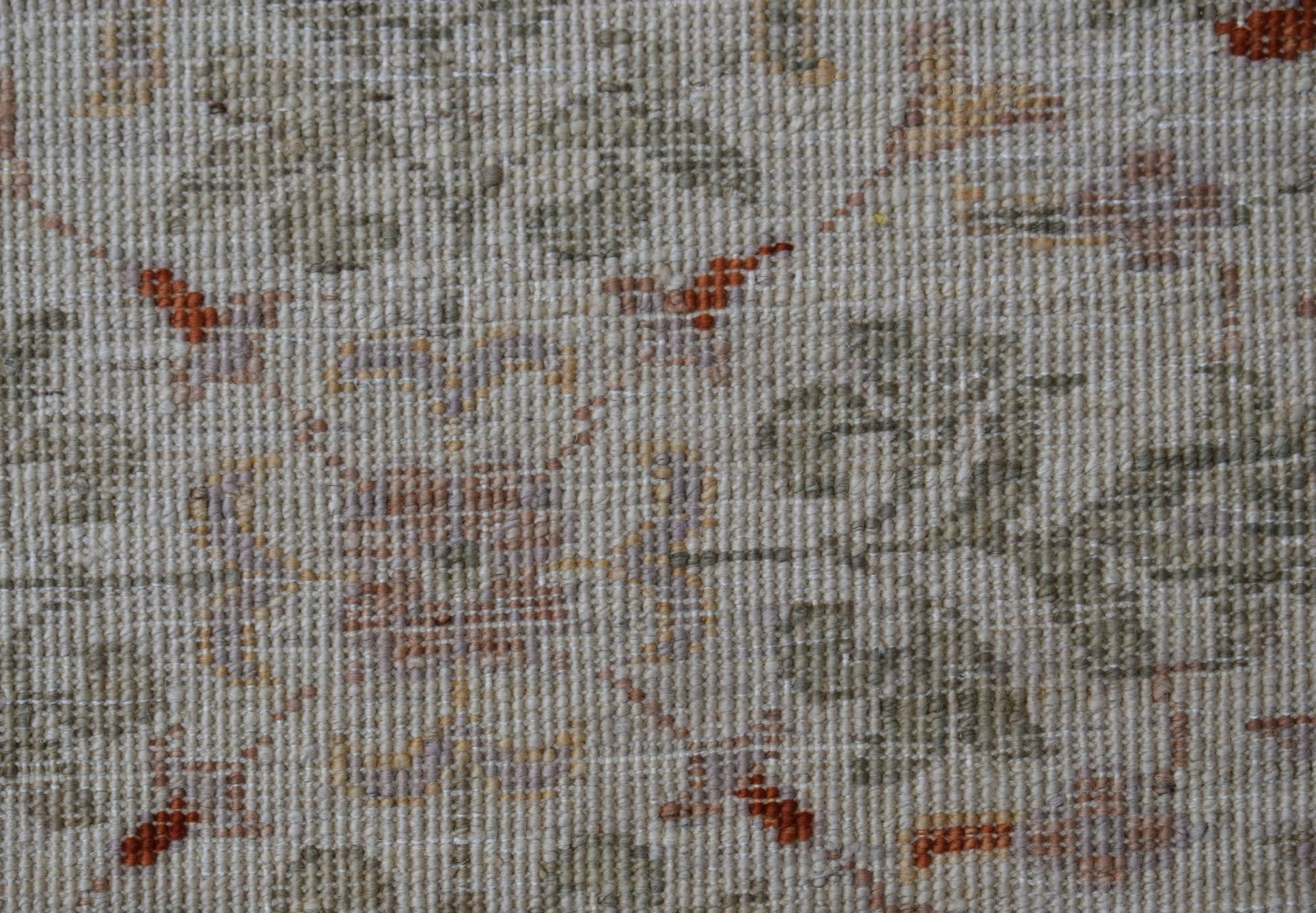 A close-up of a handwoven Afghan Chobi rug featuring a detailed Mamluk pattern in earthy tones.