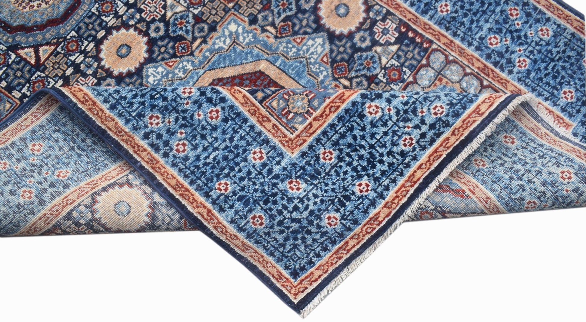 An Afghan Chobi runner rug with a blue Mamluk pattern and intricate geometric medallions.