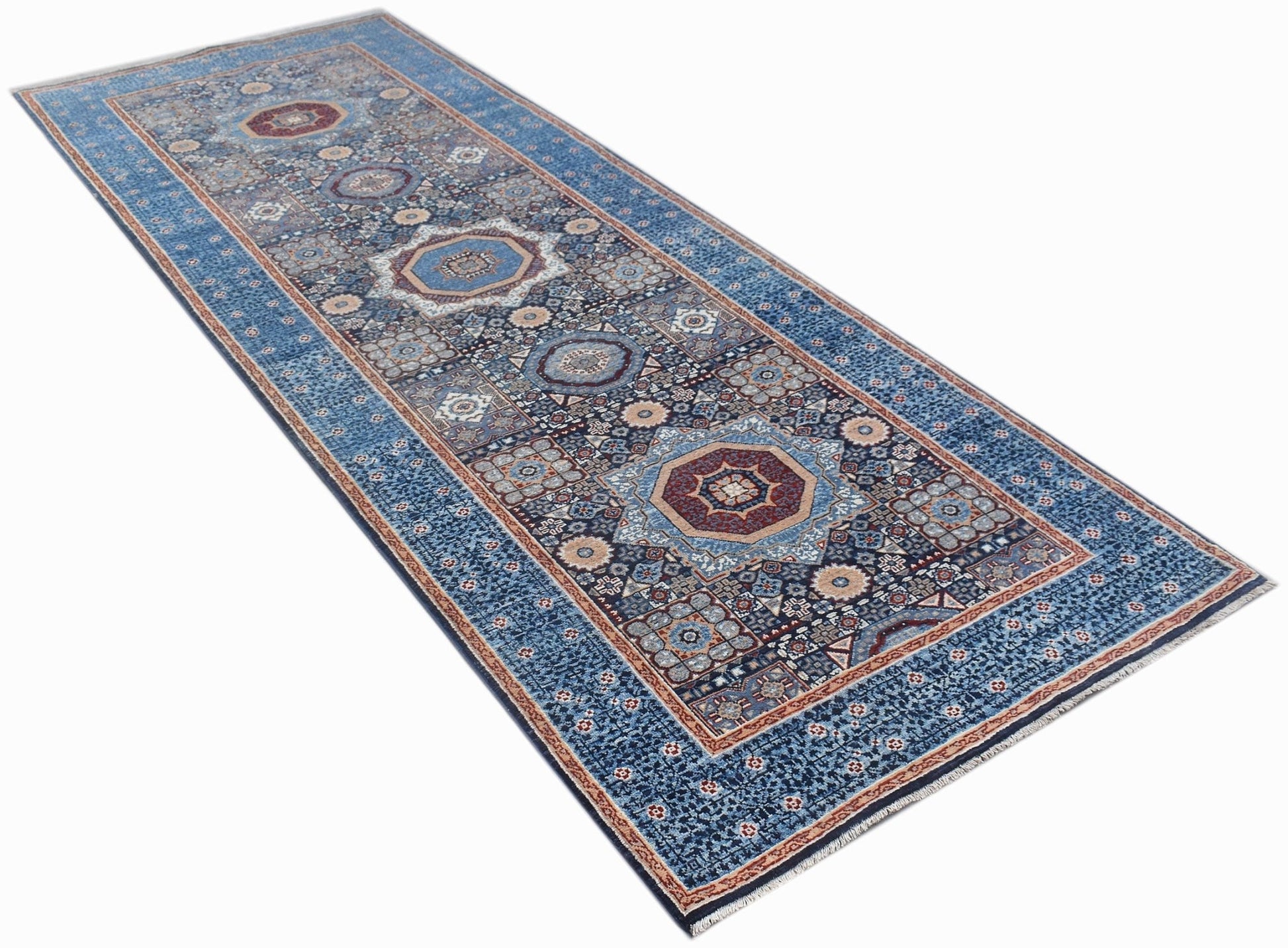 A handmade Afghan Chobi runner rug featuring a blue field with intricate Mamluk medallion patterns.