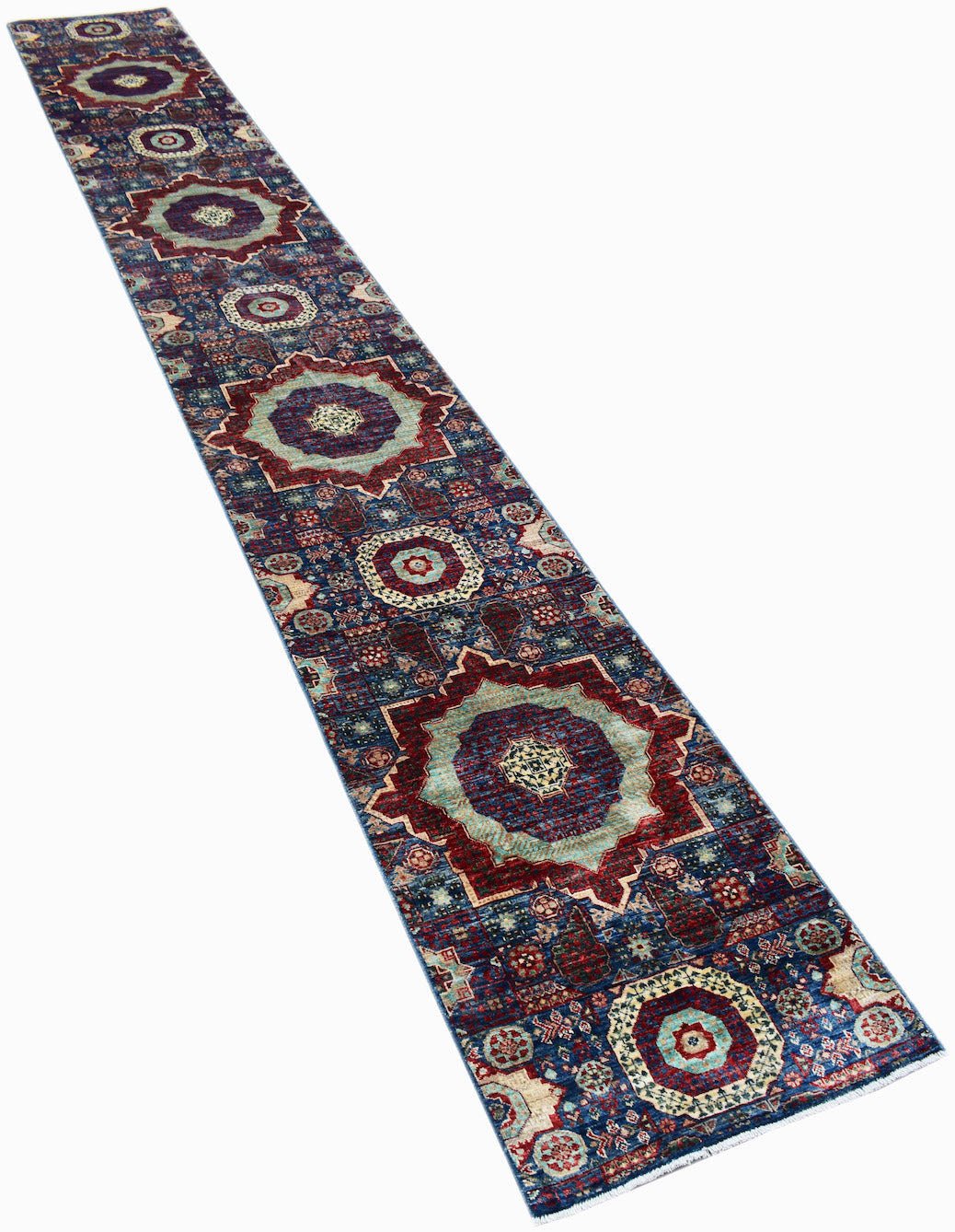A long, handmade Afghan Chobi runner rug featuring intricate Mamluk-style medallions in blue and red.