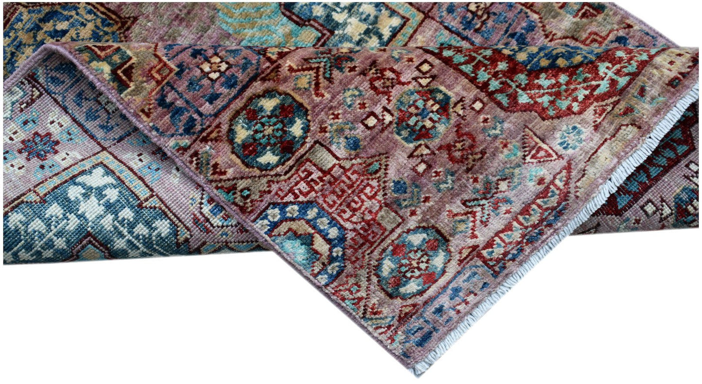 A handmade Afghan Chobi runner featuring a traditional Mamluk medallion pattern in muted tones.