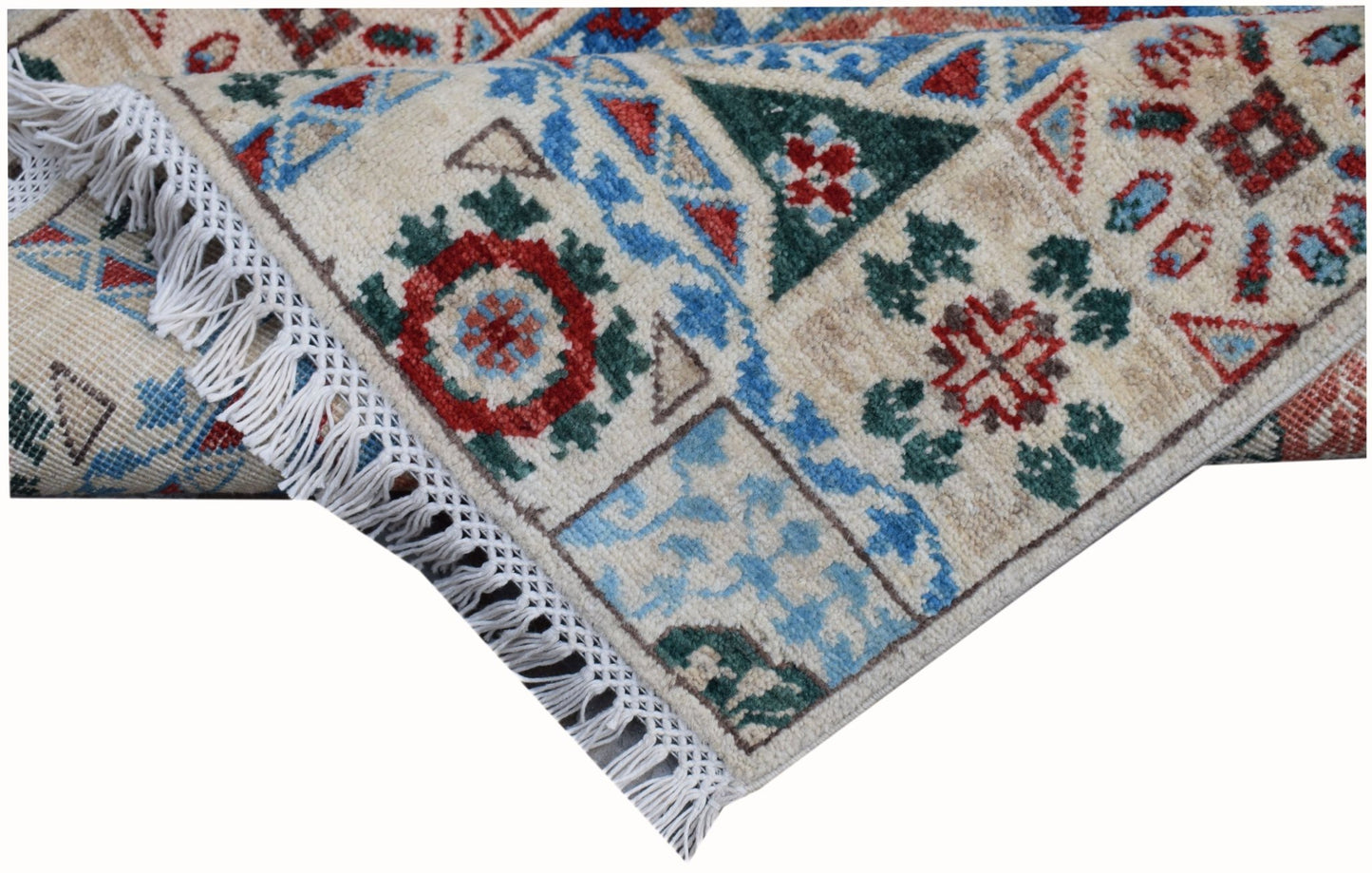 A handmade Afghan Chobi runner featuring a geometric Mamluk pattern with a cream wool pile.
