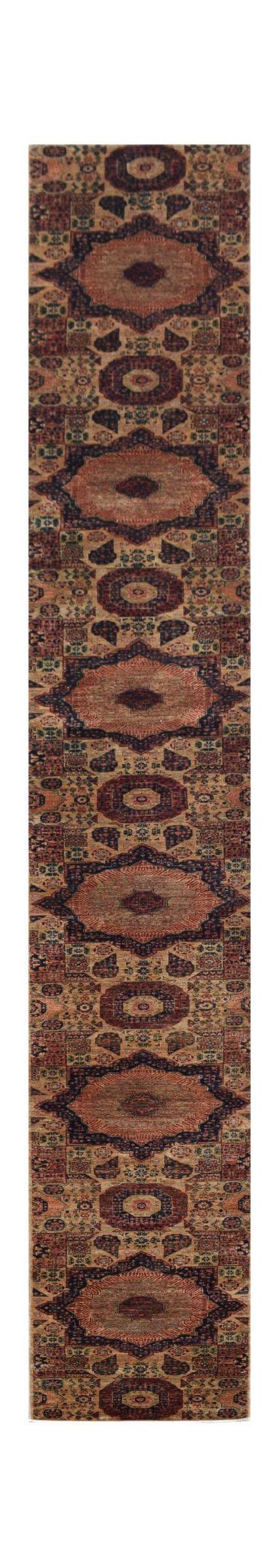 A long, handmade Afghan Chobi runner rug featuring a repeating pattern of intricate dark medallions.