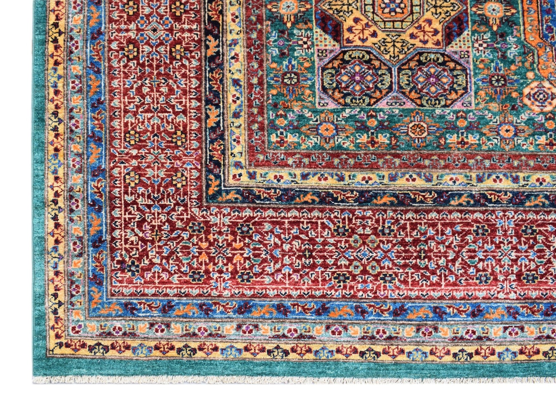 A handmade Afghan Chobi rug featuring a complex Mamluk medallion design in red, teal, and gold.