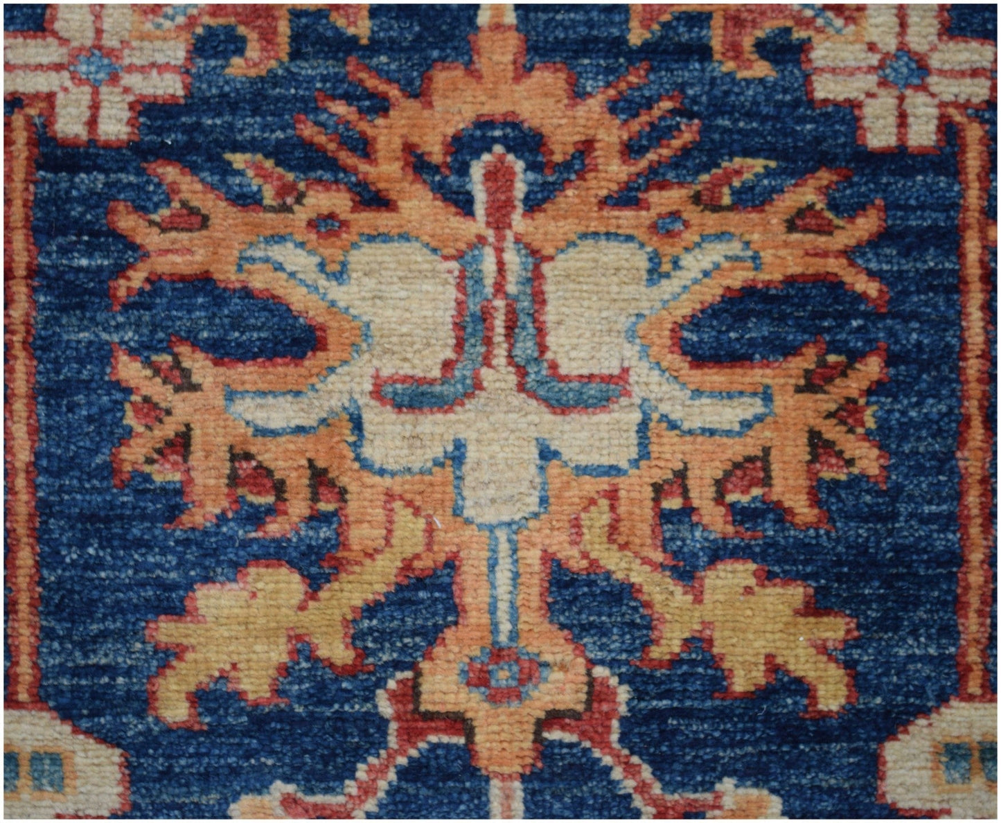 A close-up of an Afghan Super Kazakh runner featuring a traditional geometric floral motif.