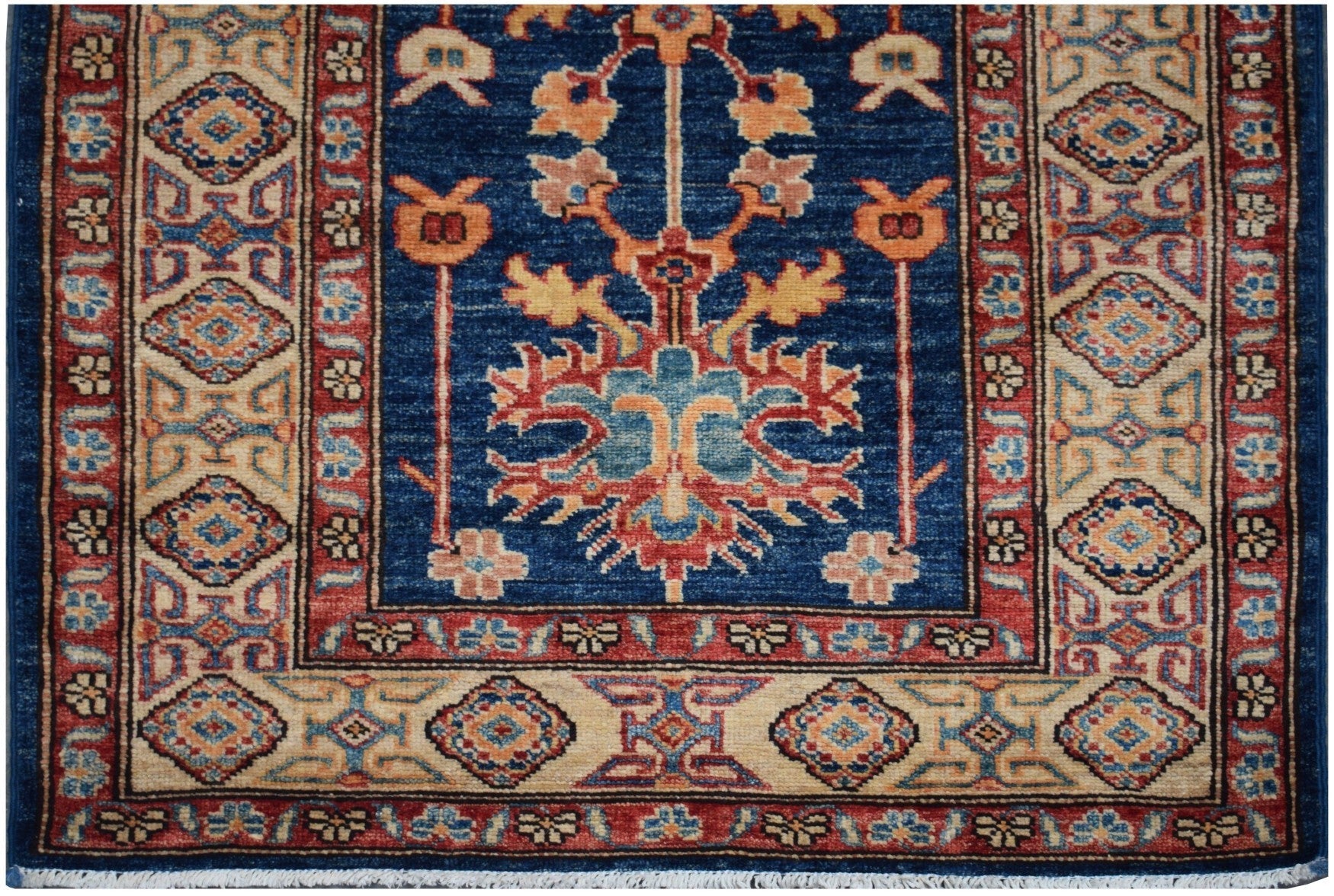 Handmade Afghan Super Kazakh runner rug featuring a blue field with traditional floral motifs.