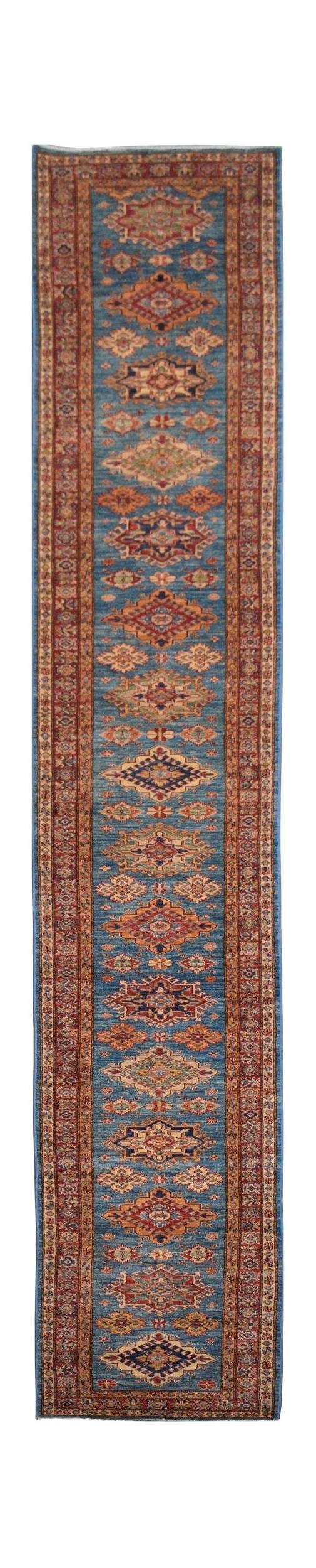 A handmade Afghan Super Kazakh runner rug featuring a blue field with repeating geometric medallions.