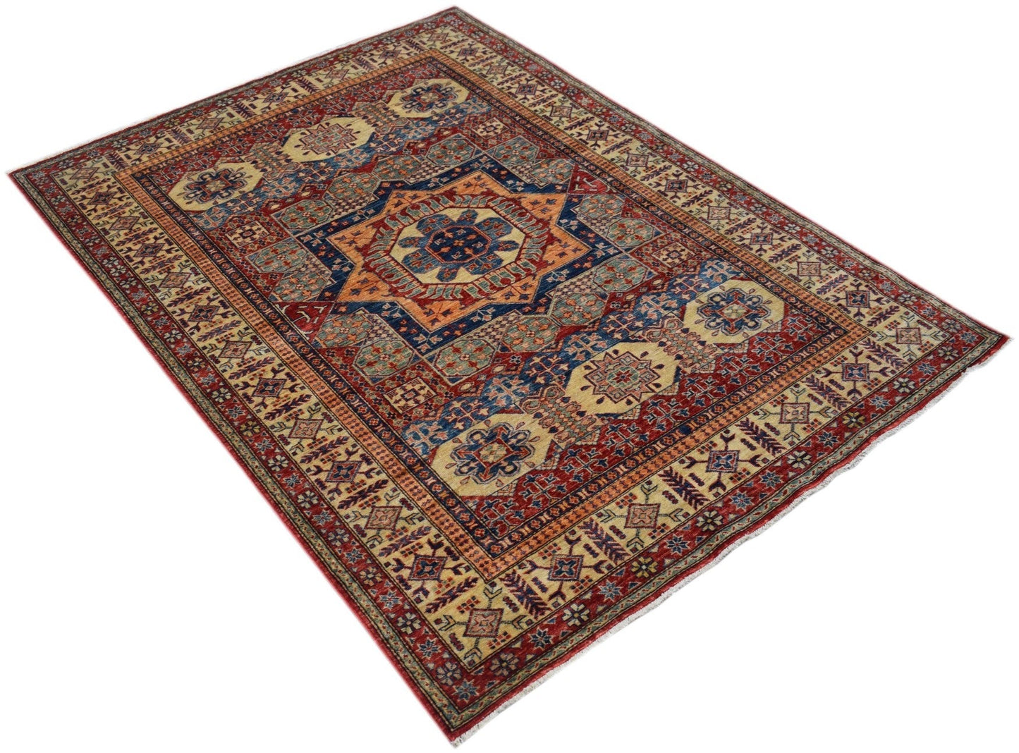 Handmade Afghan Super Kazakh rug featuring a geometric medallion pattern in red, blue, and cream.