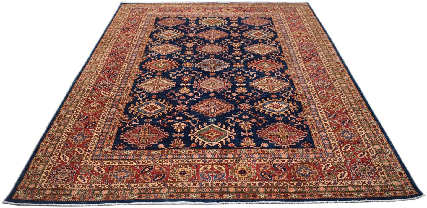 Handmade Afghan Super Kazakh rug featuring a dark blue field with geometric medallions and red borders.