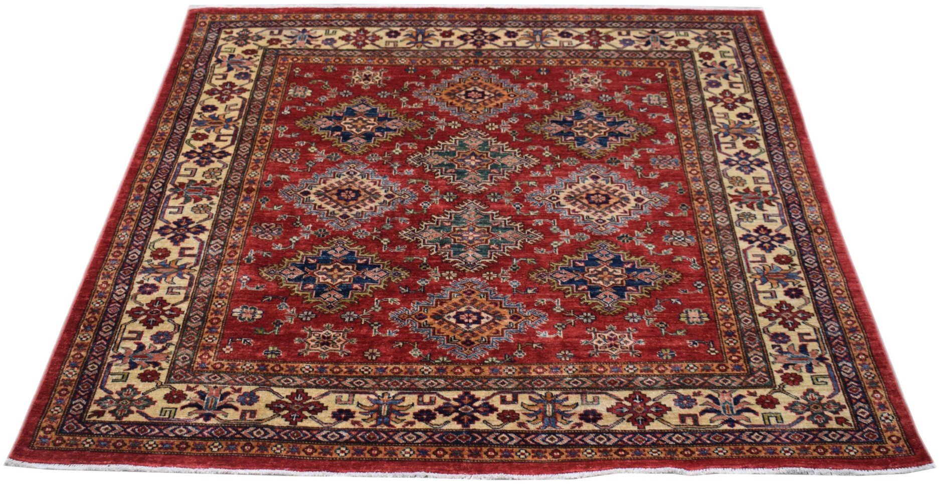 Handmade Afghan Super Kazakh rug featuring a red field with geometric medallions and floral borders.