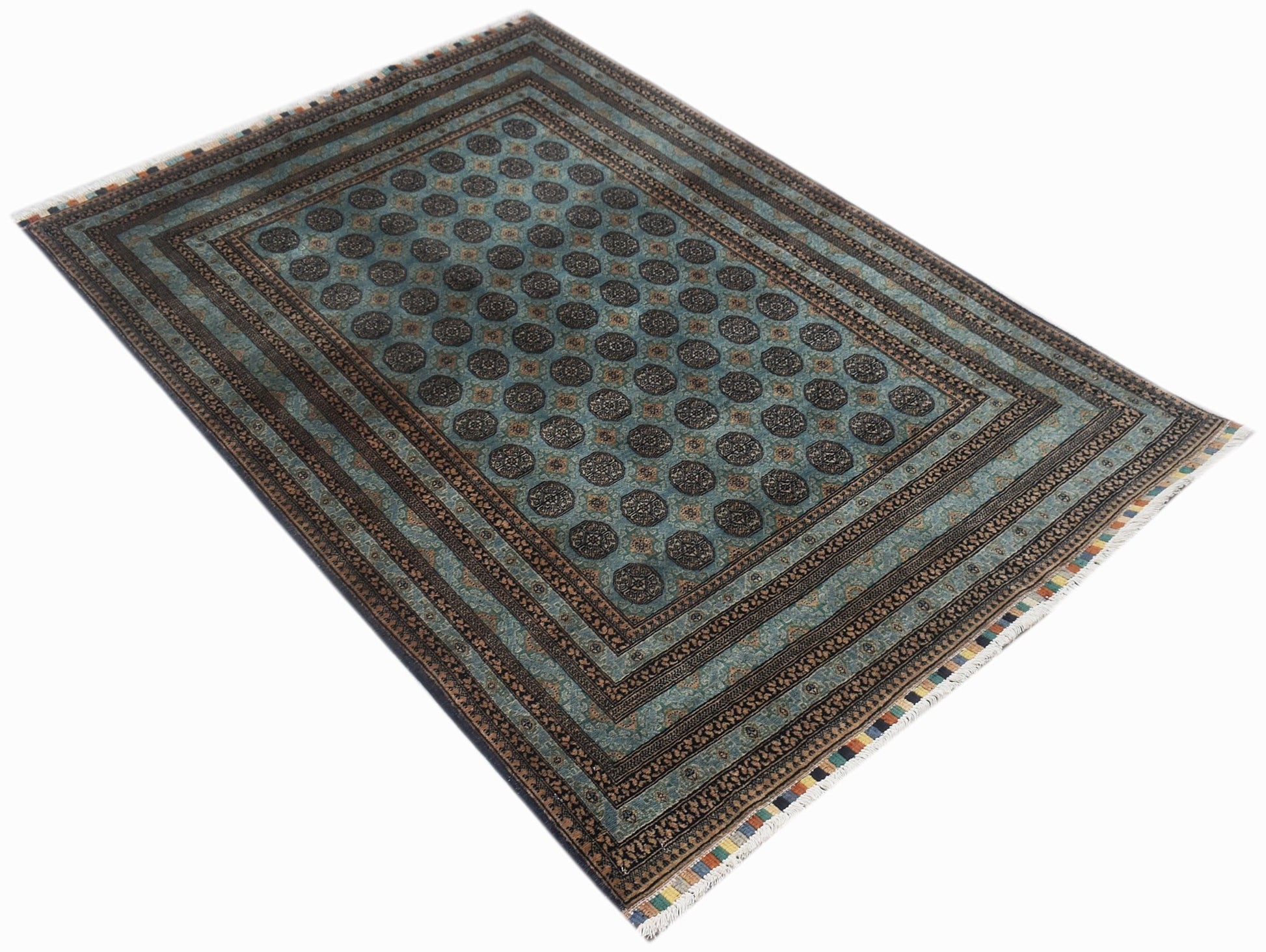 A rectangular vintage Afghan Turkmen rug featuring a repeating dark medallion pattern on teal.