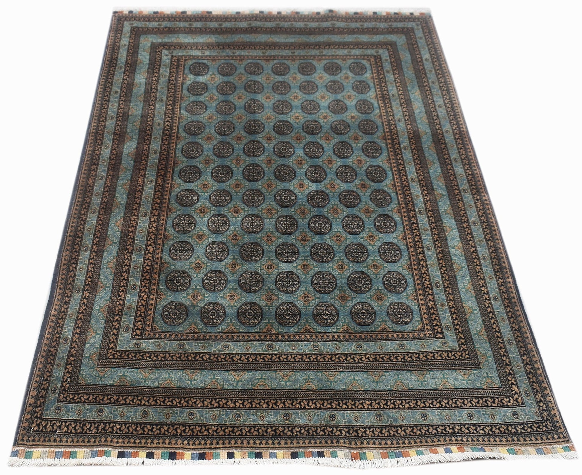 A handmade vintage Afghan Turkmen rug featuring a repeating geometric pattern in blue and brown.