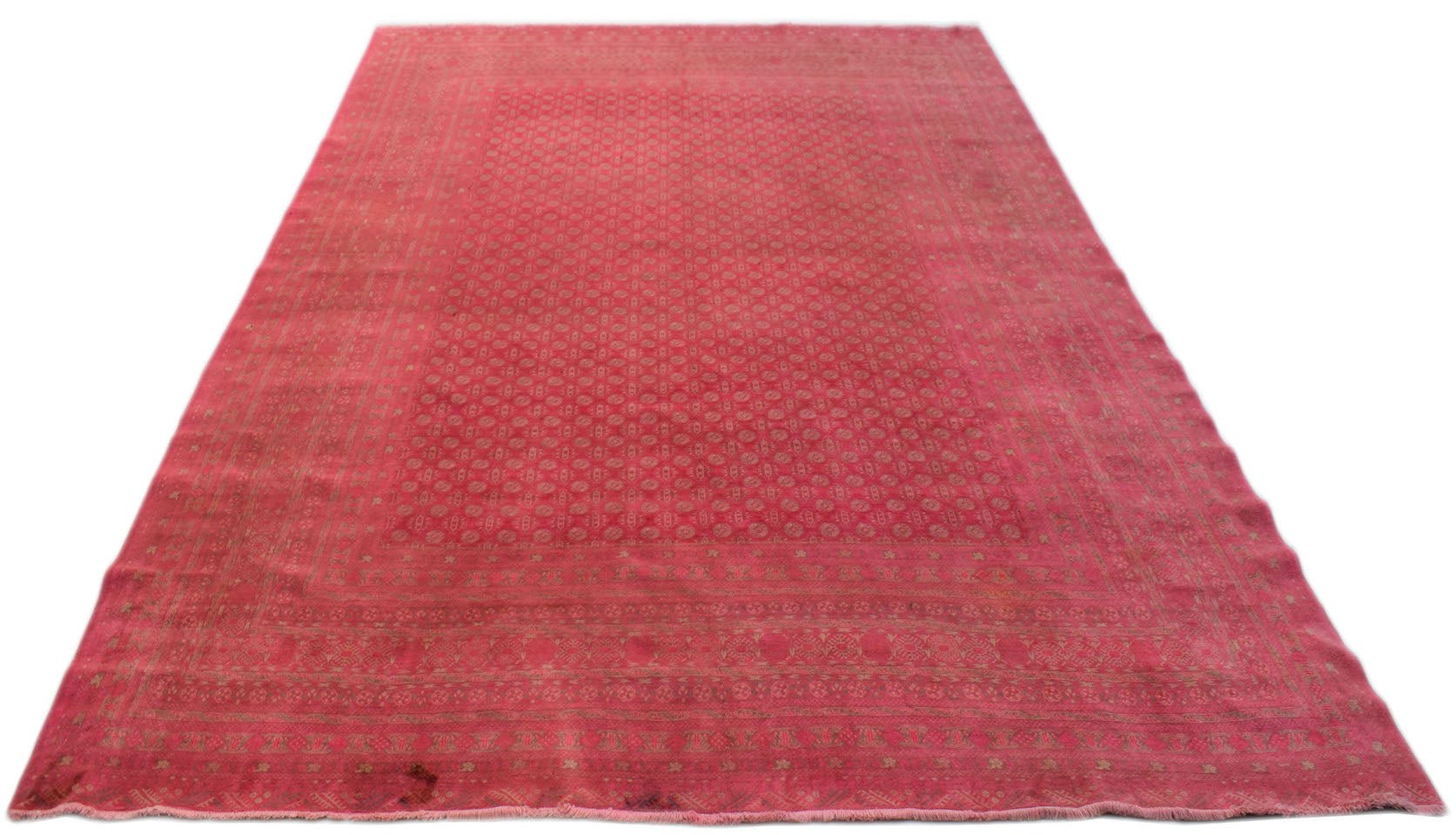 A vintage handmade Afghan Turkmen rug featuring a repeating geometric pattern in shades of red.