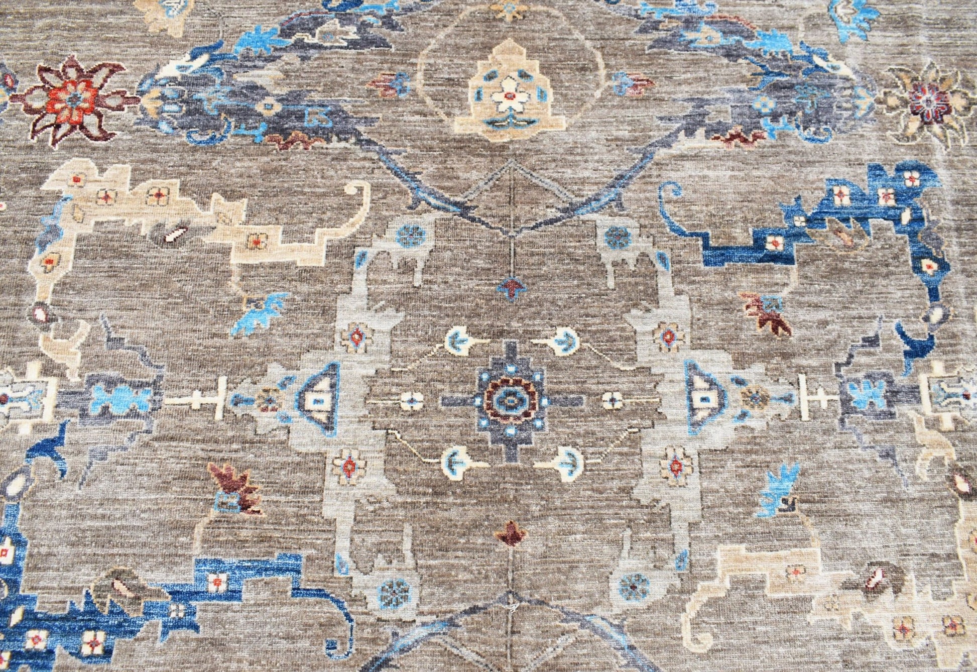 A handwoven Afghan Chobi rug featuring a traditional Bidjar pattern in earthy brown and blue tones.