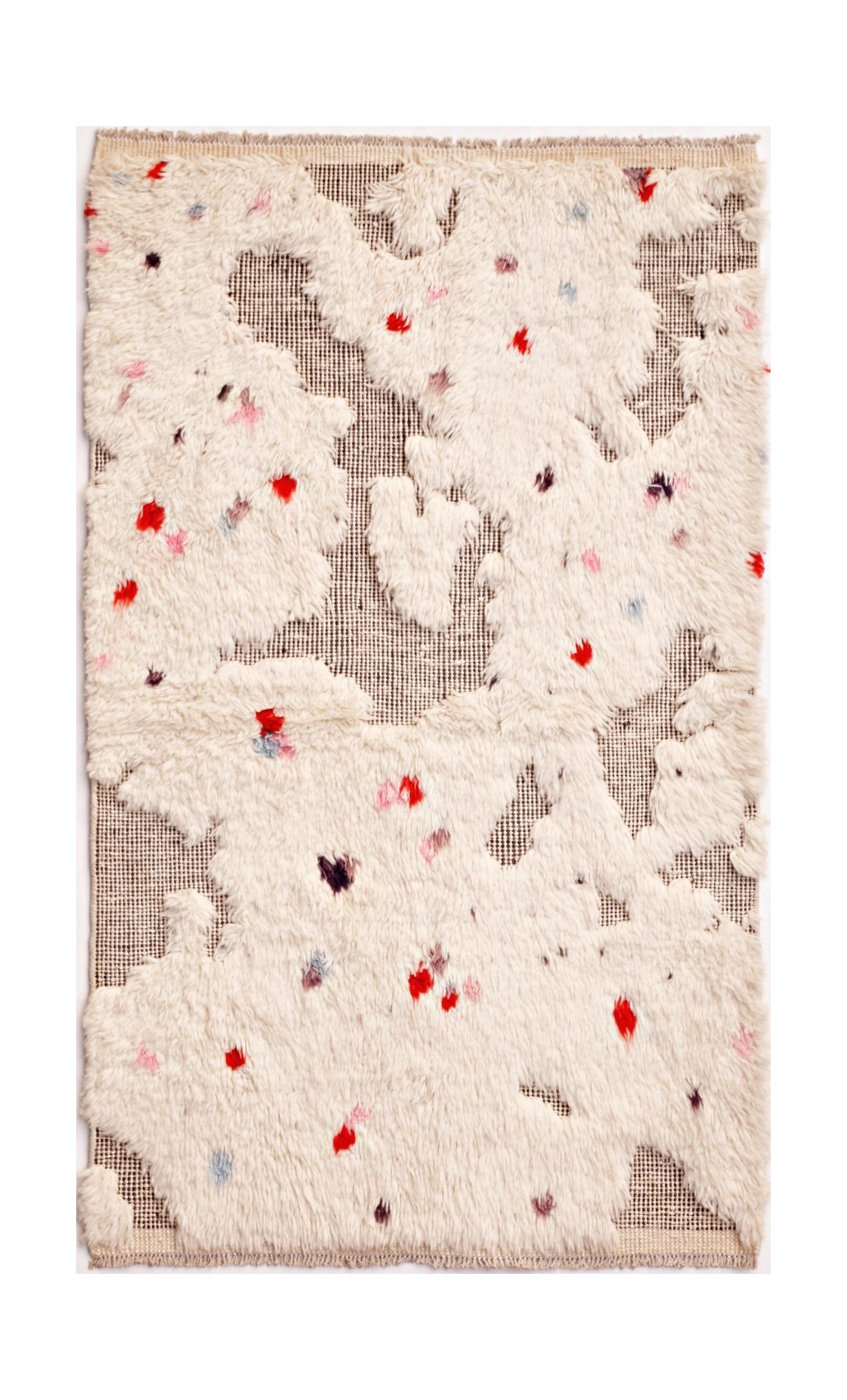 An Afghan Yekta rug featuring a textured mix of cream wool pile and exposed dark woven base.