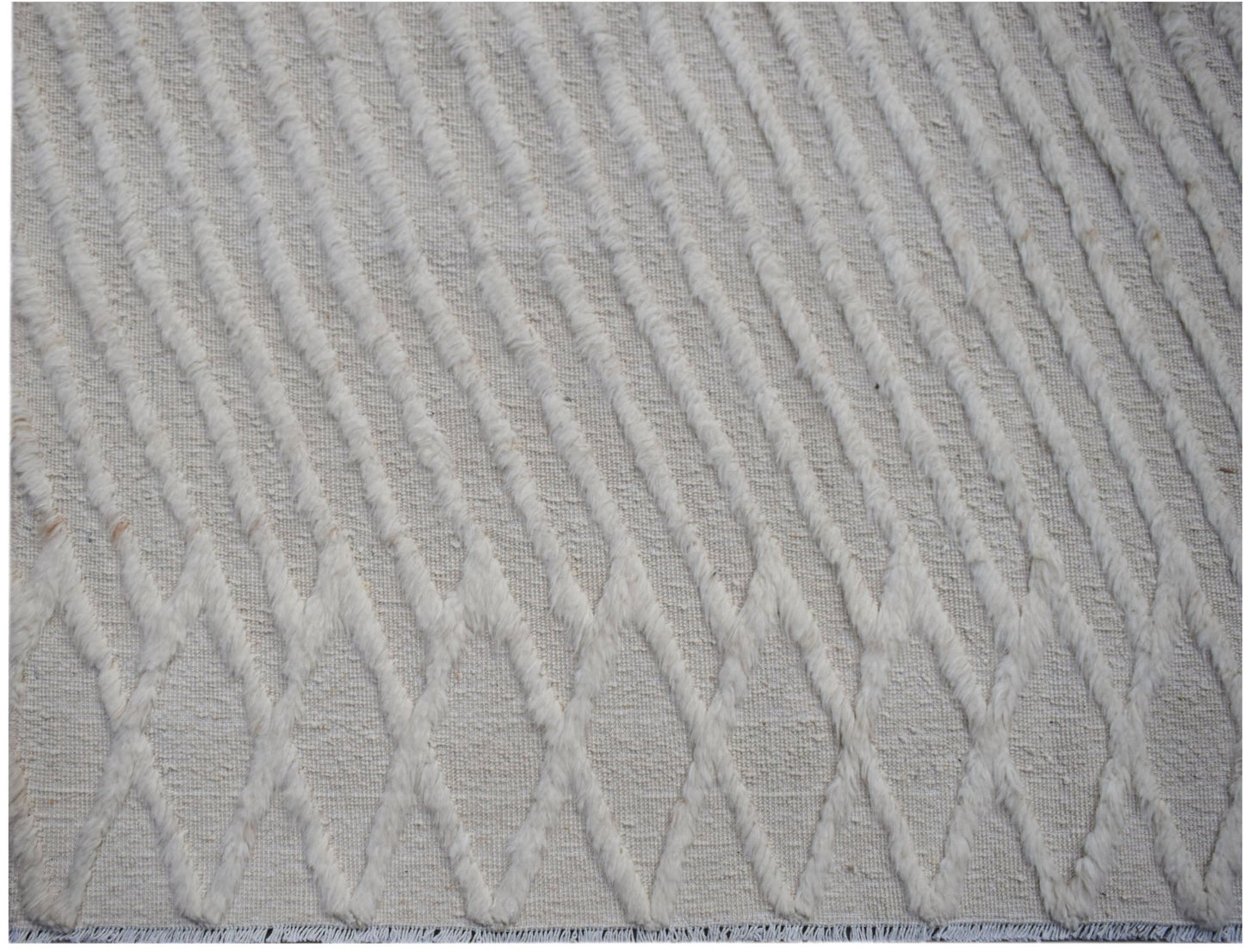 Handmade Afghan Yekta rug featuring a textured, cream-colored diamond pattern on a woven base.