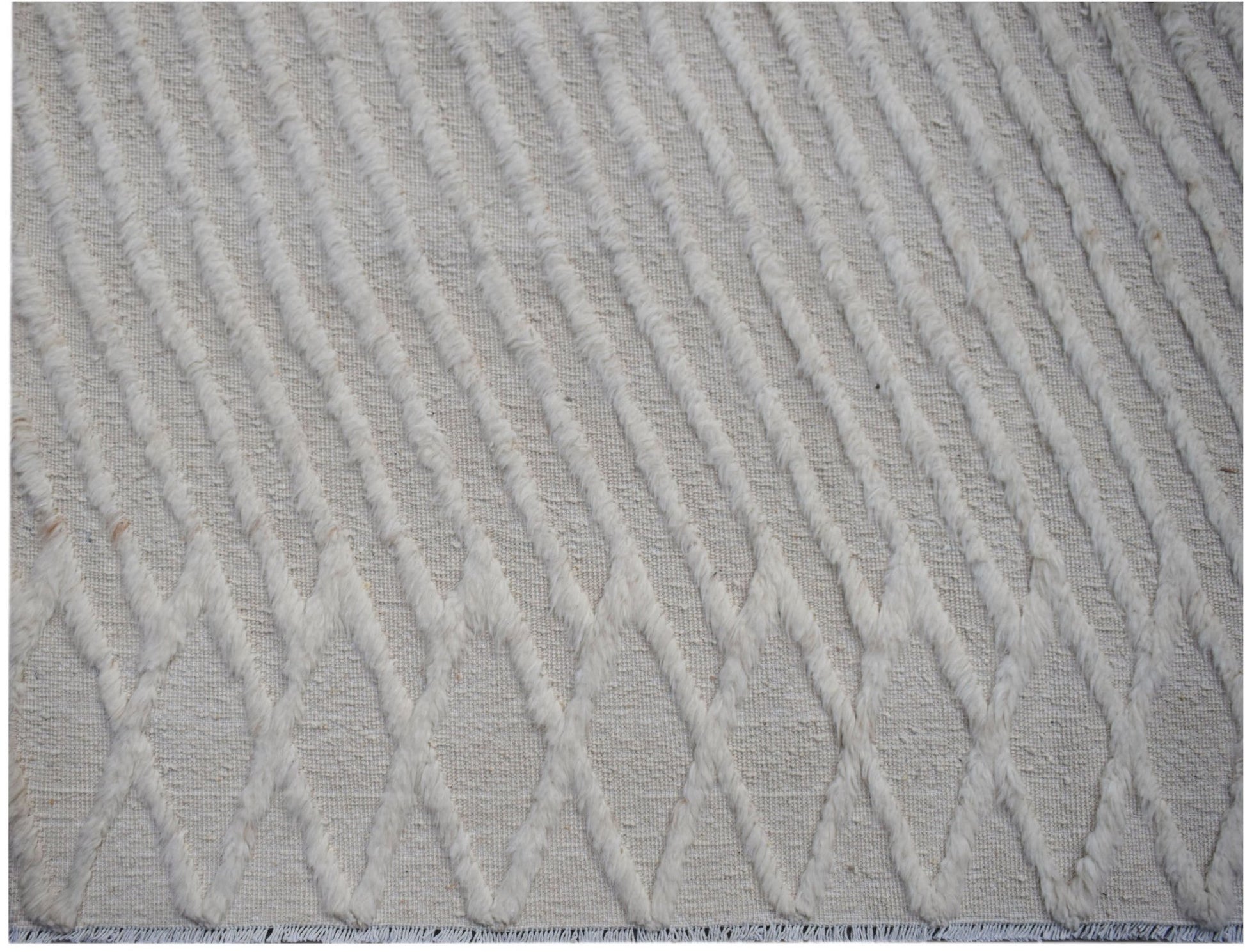 Handmade Afghan Yekta rug featuring a textured, cream-colored diamond pattern on a woven base.