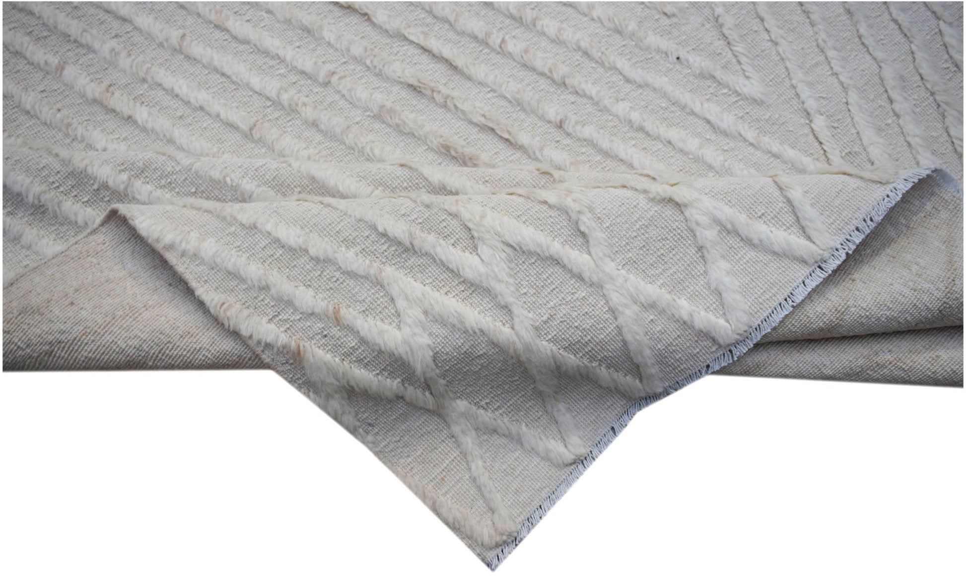 An Afghan Yekta rug featuring a textured, cream-colored geometric pattern on a woven base.