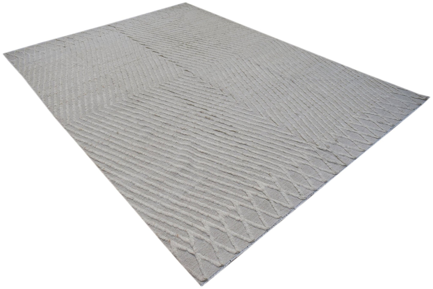 An Afghan Yekta rug featuring a textured, light-colored geometric pattern on a handspun wool base.