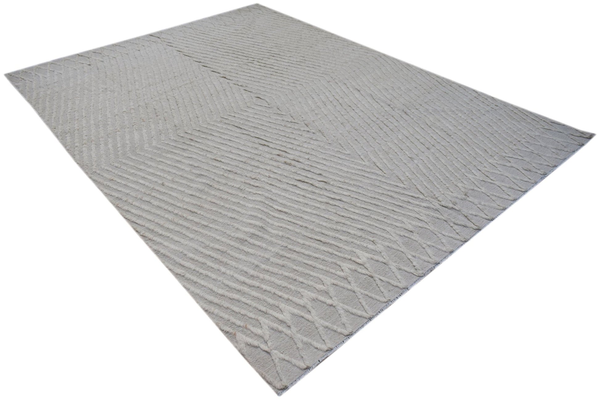 An Afghan Yekta rug featuring a textured, light-colored geometric pattern on a handspun wool base.