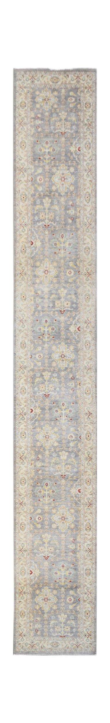 A long, handmade Afghan Chobi runner rug featuring a grey field with traditional floral patterns.