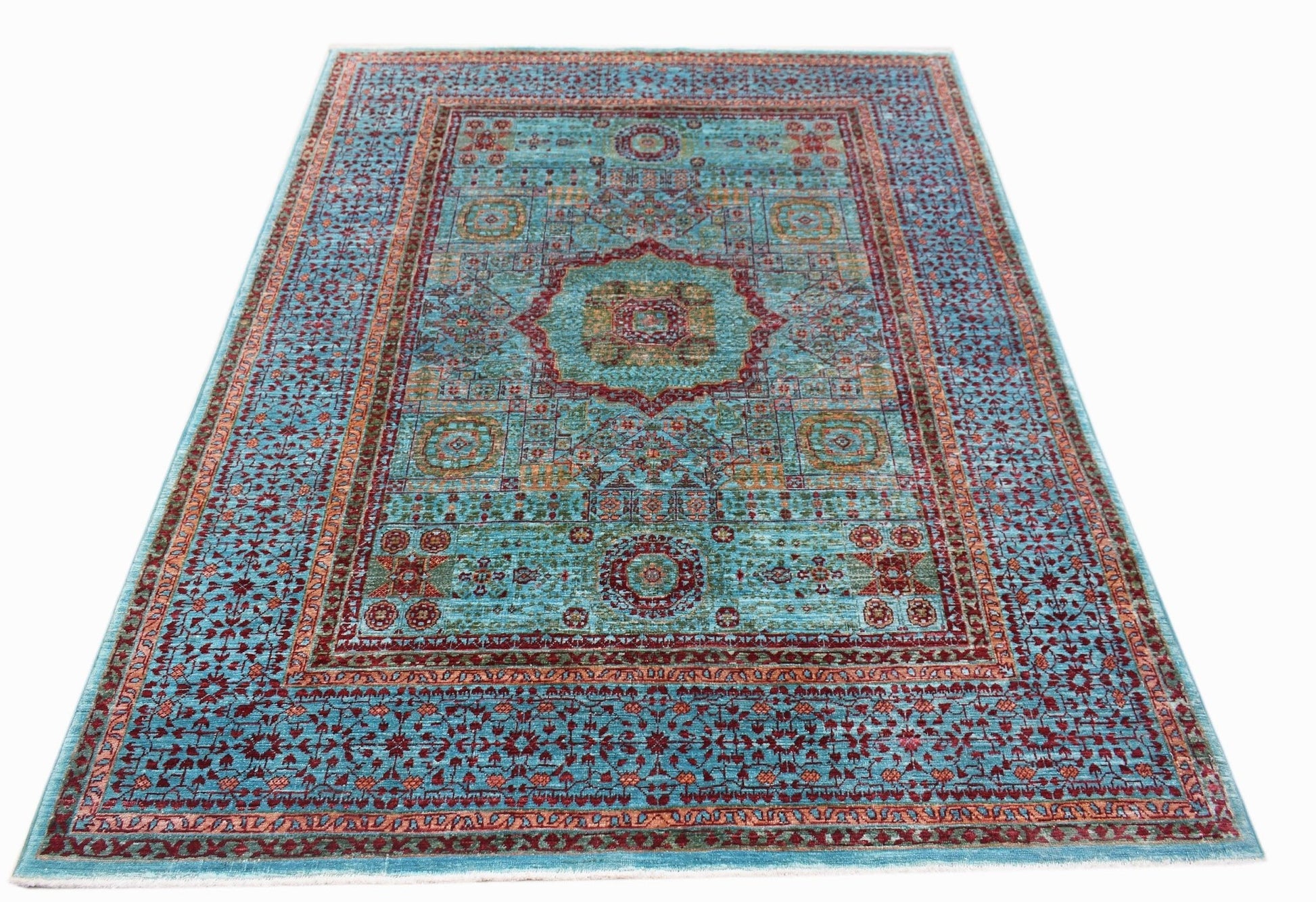 A rectangular Afghan Chobi rug featuring a detailed Mamluk medallion pattern in blue and red tones.
