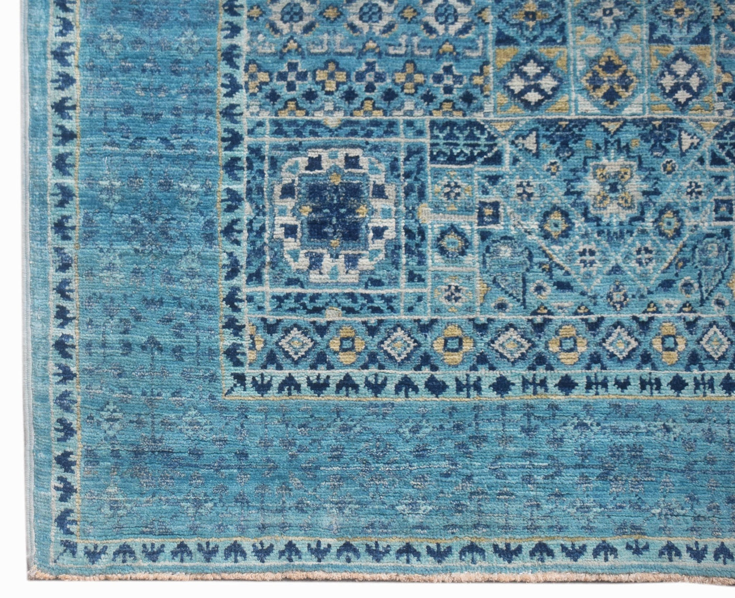 A handmade Afghan Chobi runner featuring a blue Mamluk pattern with intricate geometric motifs.