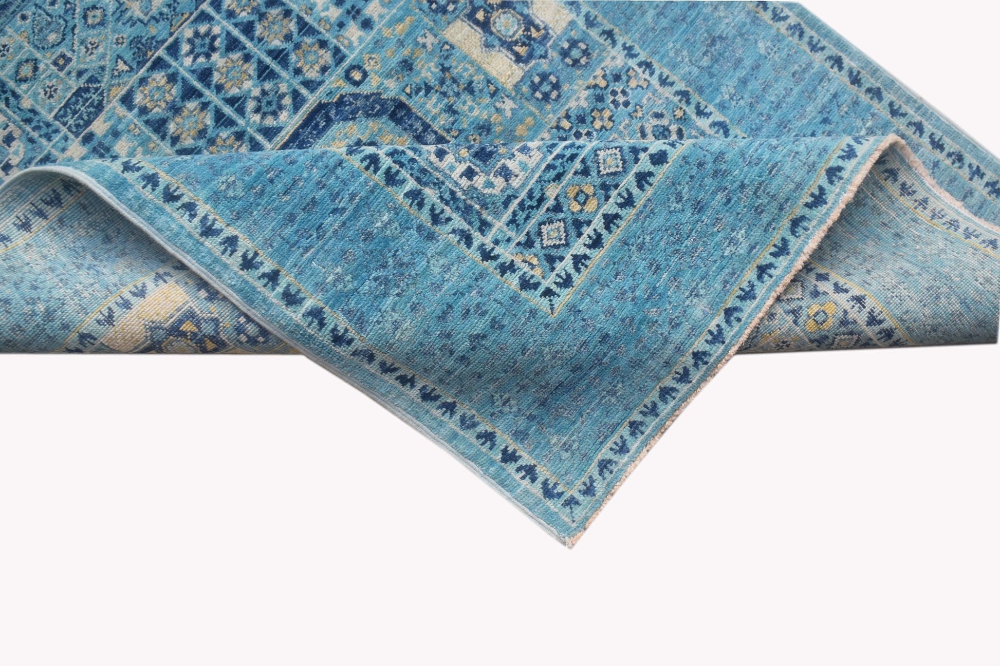 A handmade Afghan Chobi runner rug featuring a blue Mamluk pattern with intricate geometric details.