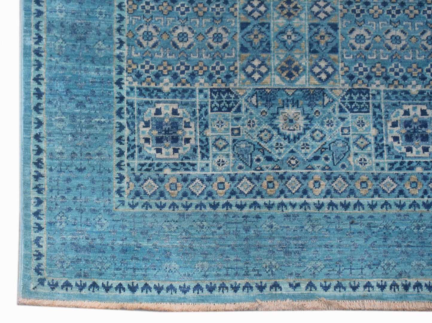 A handmade Afghan Chobi runner rug featuring intricate blue geometric Mamluk patterns.