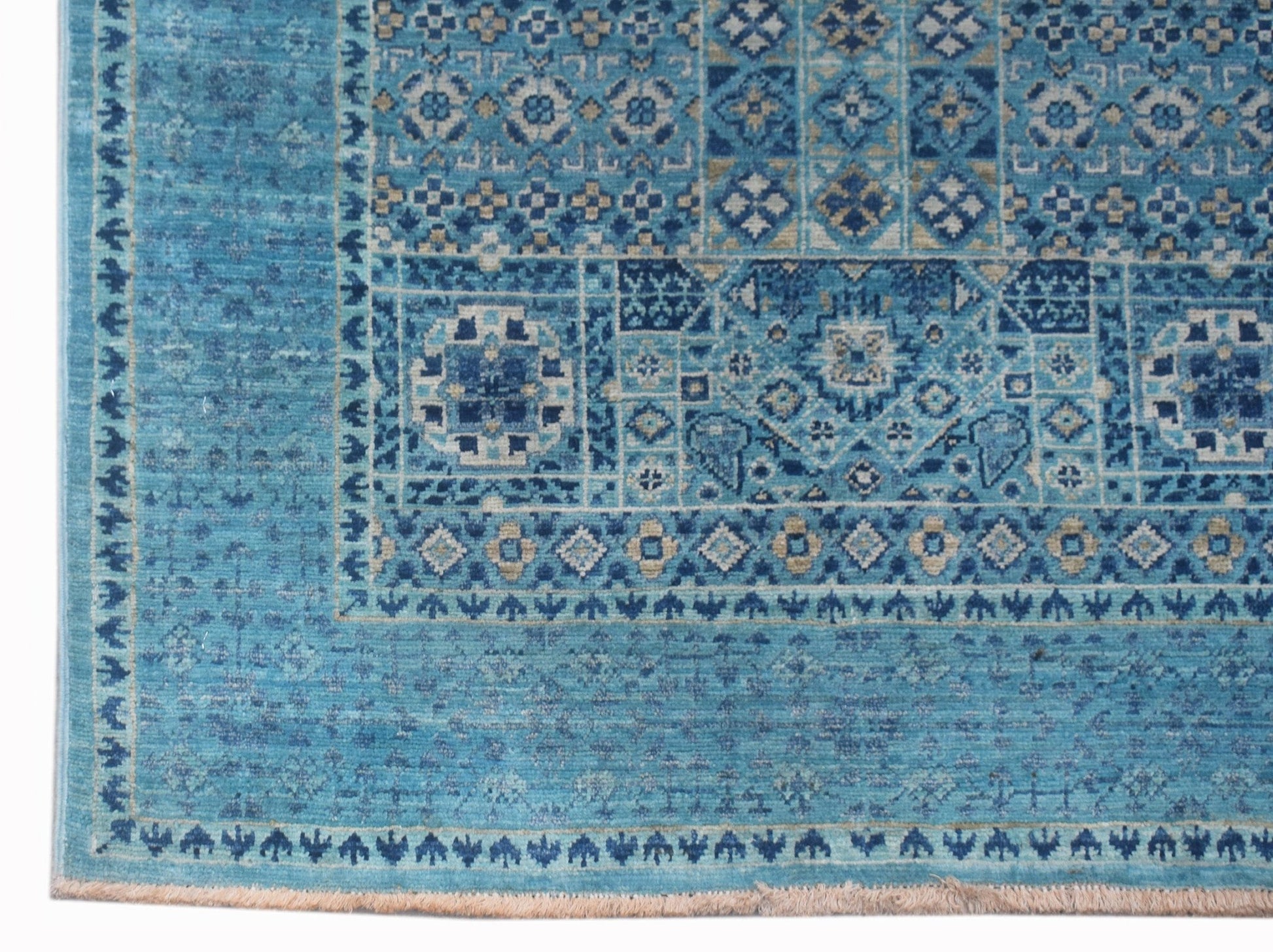 A handmade Afghan Chobi runner rug featuring intricate blue geometric Mamluk patterns.