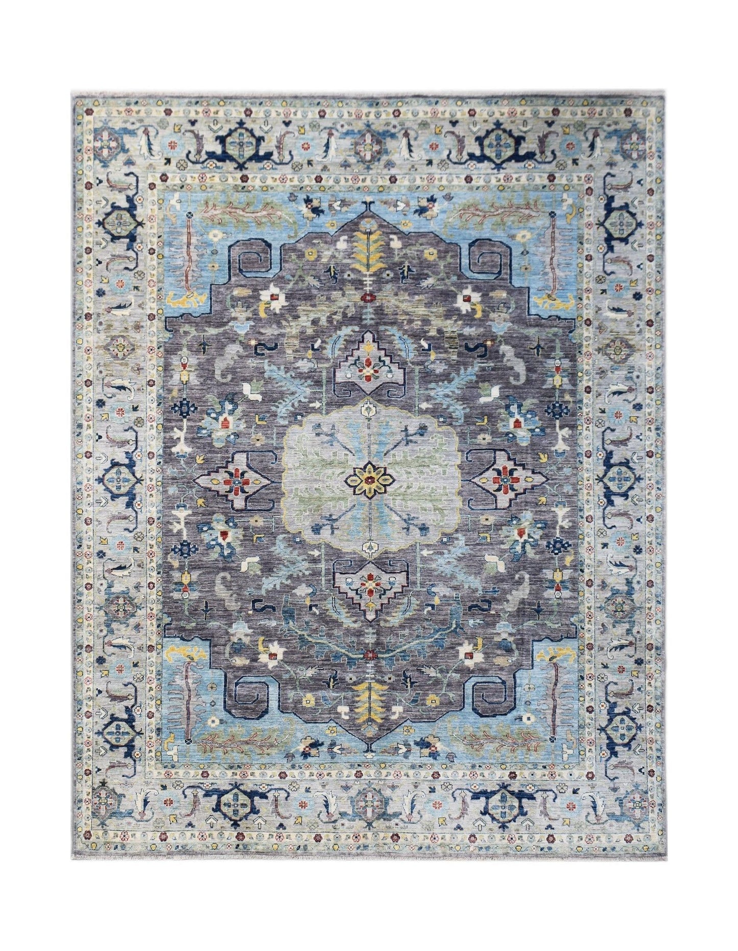 A handwoven transitional Oushak rug featuring a floral pattern in shades of grey, blue, and cream.