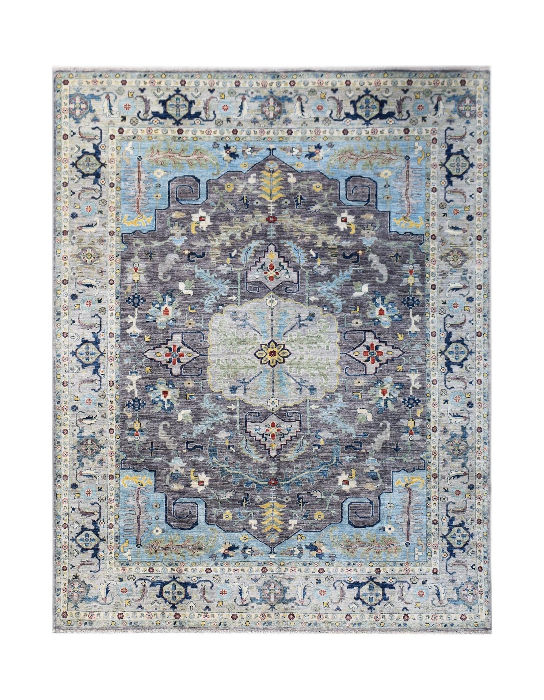 A handwoven transitional Oushak rug featuring a floral pattern in shades of grey, blue, and cream.