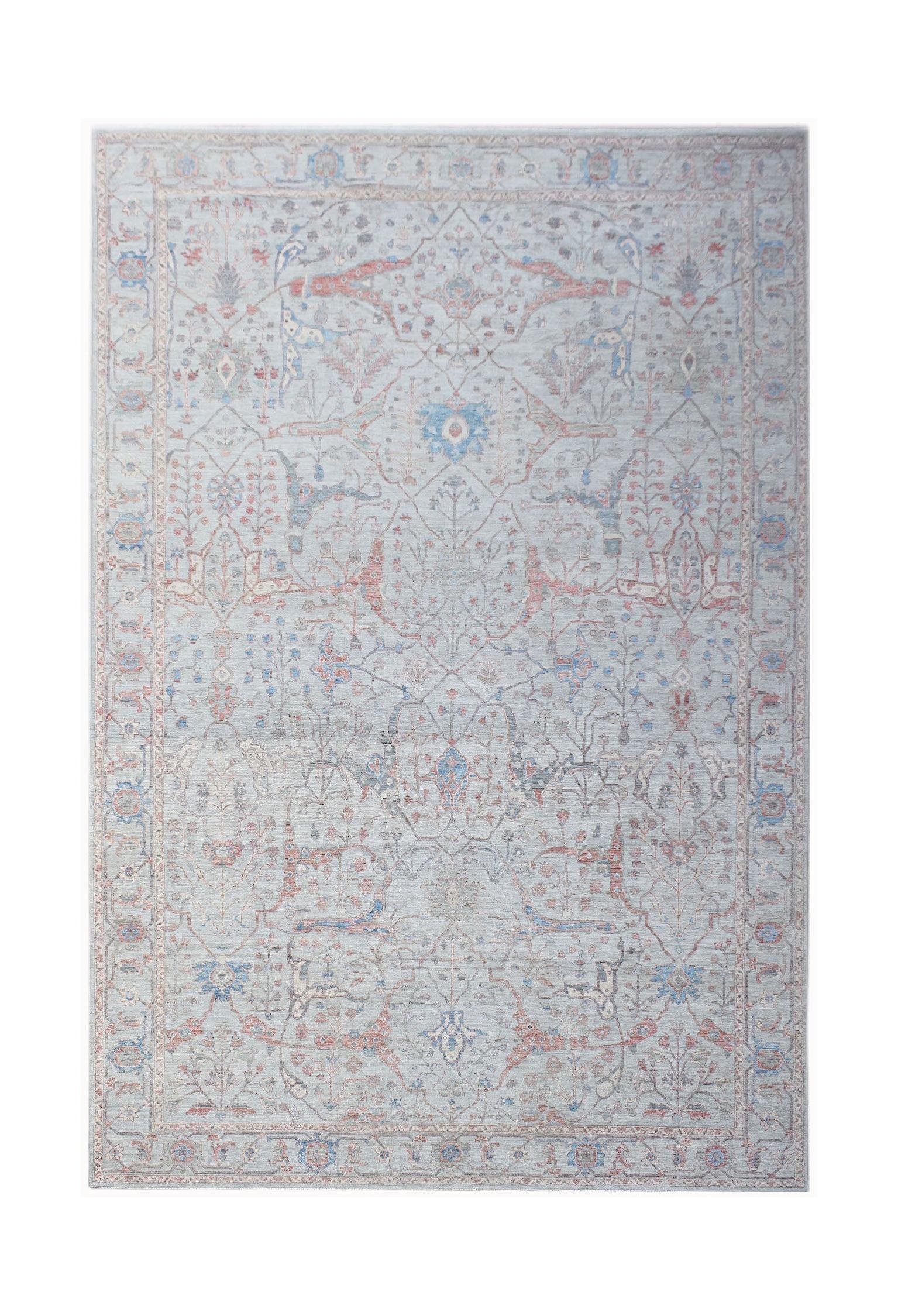 A handwoven transitional Oushak rug featuring a light blue field with soft floral patterns.