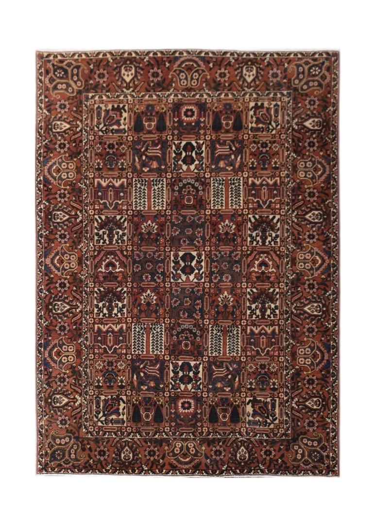 A rectangular vintage Persian rug featuring a traditional tribal pattern in shades of red and blue.