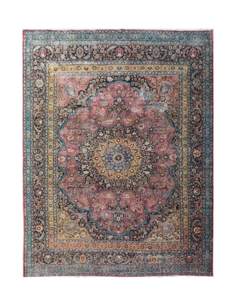 A handmade vintage Persian wool rug featuring a central floral medallion in pink and blue tones.
