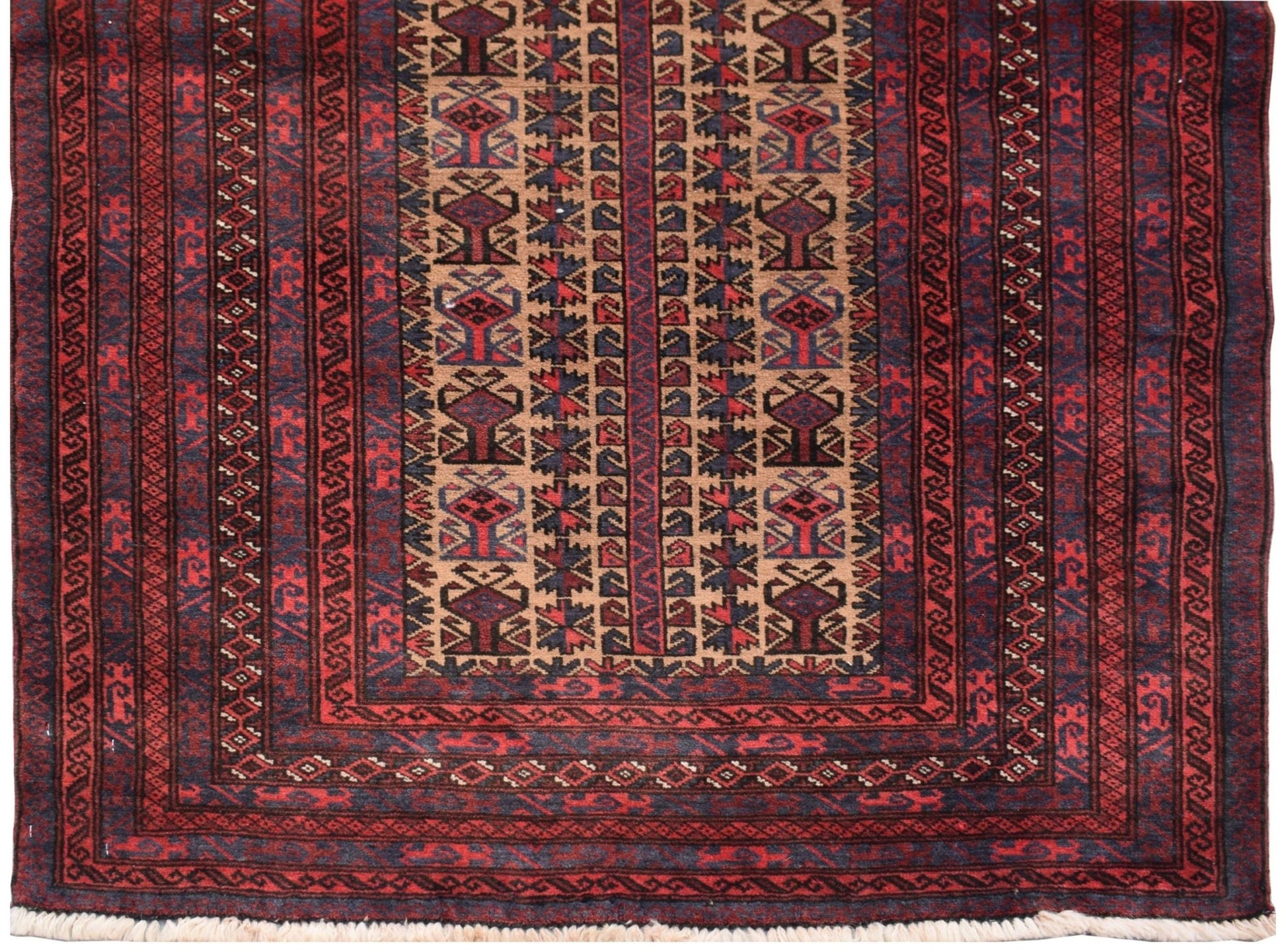 A vintage handmade Afghan Baluch rug featuring geometric tribal patterns in red, brown, and blue.